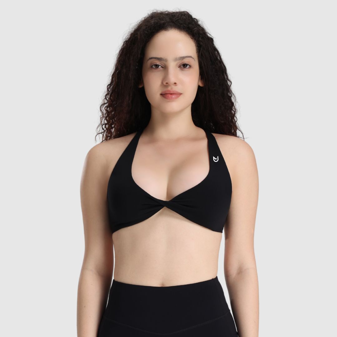 UNANIMOUS Twist Sport-BH in Schwarz mit Twist-Front und Crossback-Trägern – Vorderansicht
